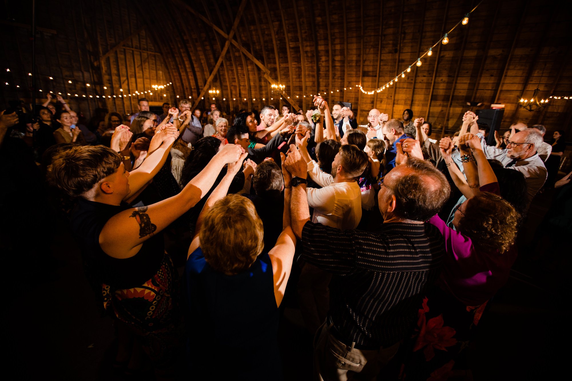Guests filling the barn dance floor.